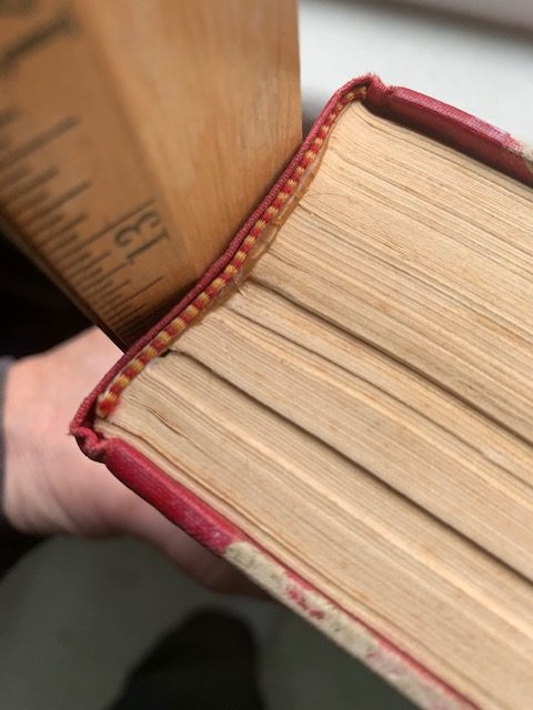 fixing a broken book make sure the pages are pressed flush against the spine